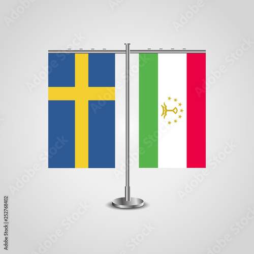 Table stand with flags of Sweden and Tajikistan.Two flag. Flag pole. Symbolizing the cooperation between the two countries. Table flags