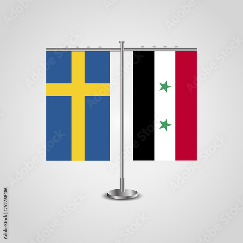 Table stand with flags of Sweden and Syria.Two flag. Flag pole. Symbolizing the cooperation between the two countries. Table flags