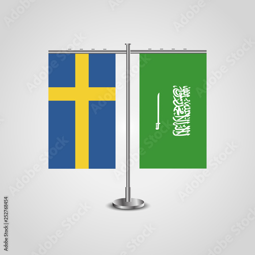 Table stand with flags of Sweden and Saudi Arabia.Two flag. Flag pole. Symbolizing the cooperation between the two countries. Table flags