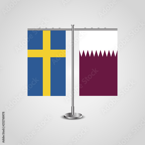 Table stand with flags of Sweden and Qatar.Two flag. Flag pole. Symbolizing the cooperation between the two countries. Table flags