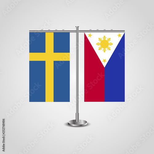 Table stand with flags of Sweden and Philippines.Two flag. Flag pole. Symbolizing the cooperation between the two countries. Table flags