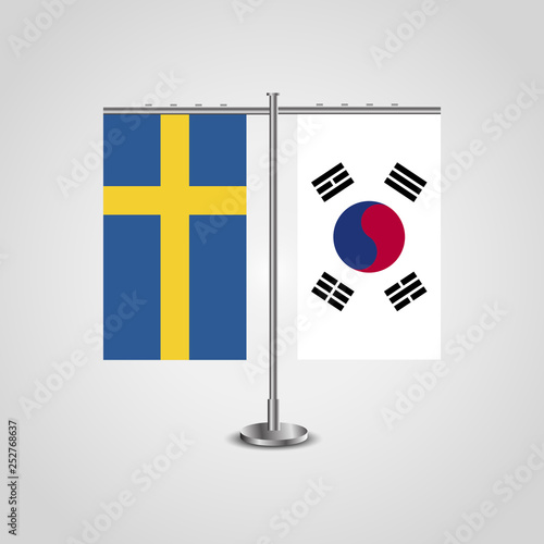 Table stand with flags of Sweden and South Korea.Two flag. Flag pole. Symbolizing the cooperation between the two countries. Table flags