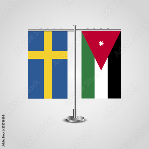 Table stand with flags of Sweden and Jordan.Two flag. Flag pole. Symbolizing the cooperation between the two countries. Table flags