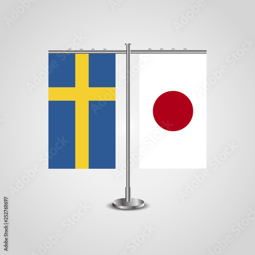 Table stand with flags of Sweden and Japan.Two flag. Flag pole. Symbolizing the cooperation between the two countries. Table flags