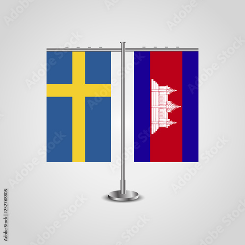 Table stand with flags of Sweden and Cambodia.Two flag. Flag pole. Symbolizing the cooperation between the two countries. Table flags