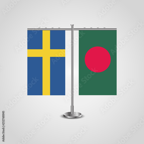 Table stand with flags of Sweden and Bangladesh.Two flag. Flag pole. Symbolizing the cooperation between the two countries. Table flags
