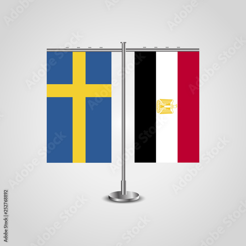 Table stand with flags of Sweden and Egypt.Two flag. Flag pole. Symbolizing the cooperation between the two countries. Table flags