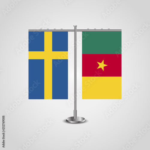 Table stand with flags of Sweden and Cameroon.Two flag. Flag pole. Symbolizing the cooperation between the two countries. Table flags