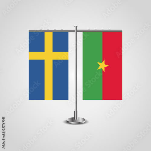 Table stand with flags of Sweden and Burkina Faso.Two flag. Flag pole. Symbolizing the cooperation between the two countries. Table flags