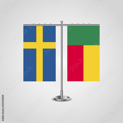Table stand with flags of Sweden and Benin.Two flag. Flag pole. Symbolizing the cooperation between the two countries. Table flags