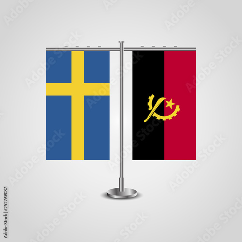 Table stand with flags of Sweden and Angola.Two flag. Flag pole. Symbolizing the cooperation between the two countries. Table flags