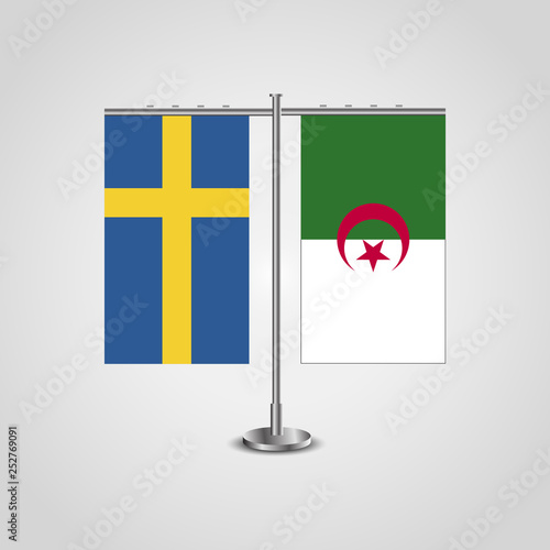Table stand with flags of Sweden and Algeria.Two flag. Flag pole. Symbolizing the cooperation between the two countries. Table flags