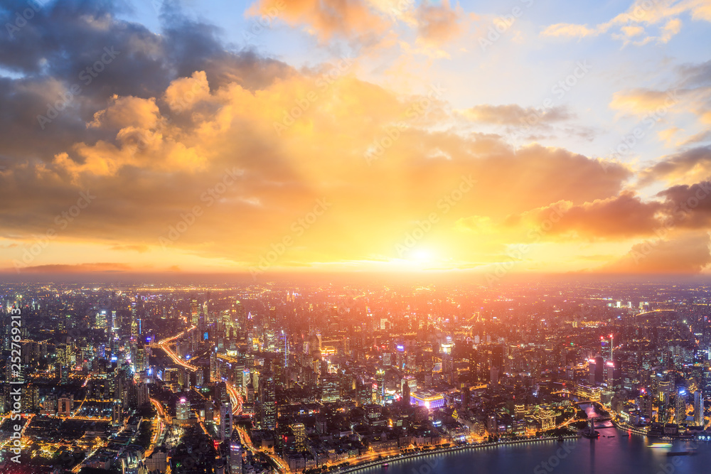 Shanghai city skyline and beautiful colorful clouds at sunset