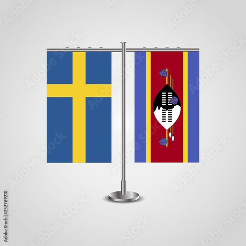 Table stand with flags of Sweden and Swaziland.Two flag. Flag pole. Symbolizing the cooperation between the two countries. Table flags