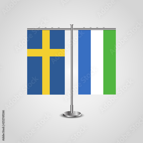 Table stand with flags of Sweden and Sierra Leone.Two flag. Flag pole. Symbolizing the cooperation between the two countries. Table flags