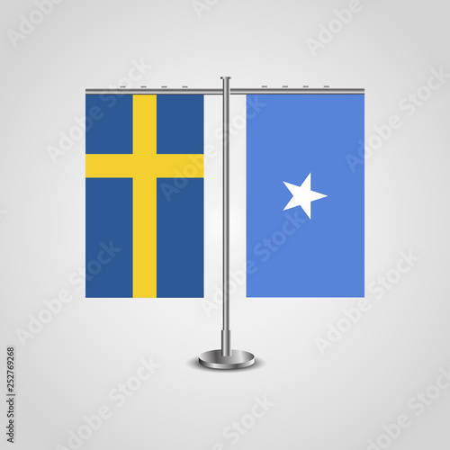 Table stand with flags of Sweden and Somalia.Two flag. Flag pole. Symbolizing the cooperation between the two countries. Table flags