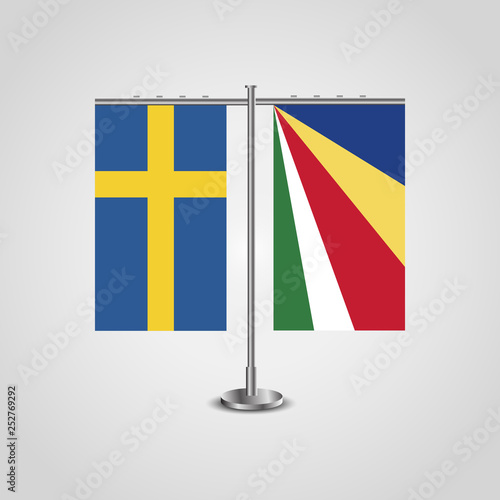 Table stand with flags of Sweden and Seychelles.Two flag. Flag pole. Symbolizing the cooperation between the two countries. Table flags