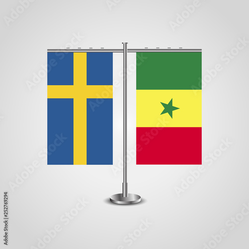 Table stand with flags of Sweden and SenegalTwo flag. Flag pole. Symbolizing the cooperation between the two countries. Table flags