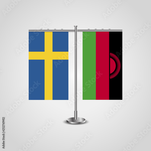 Table stand with flags of Sweden and Malawi.Two flag. Flag pole. Symbolizing the cooperation between the two countries. Table flags