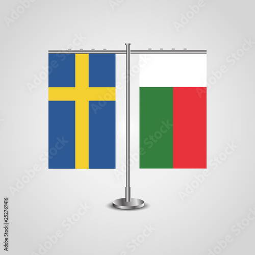 Table stand with flags of Sweden and Madagascar.Two flag. Flag pole. Symbolizing the cooperation between the two countries. Table flags