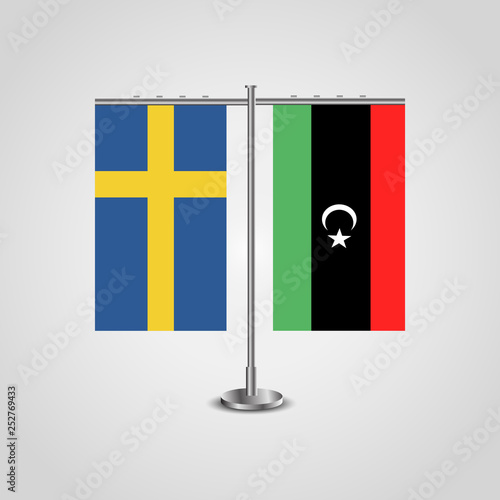 Table stand with flags of Sweden and Libya.Two flag. Flag pole. Symbolizing the cooperation between the two countries. Table flags