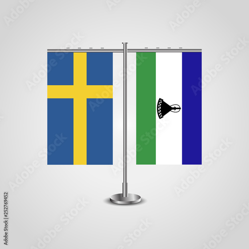 Table stand with flags of Sweden and Lesotho.Two flag. Flag pole. Symbolizing the cooperation between the two countries. Table flags