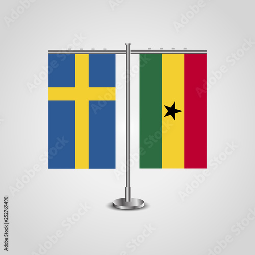 Table stand with flags of Sweden and Ghana.Two flag. Flag pole. Symbolizing the cooperation between the two countries. Table flags