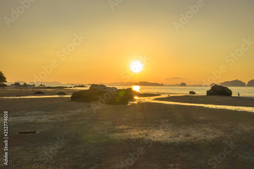 Tup Kaek beach close to Kwang beach and non Nak mountain during low tide .can see long and large beach can walk around many big rocks on the beach .beautiful sunset behind archipelago in Andaman sea