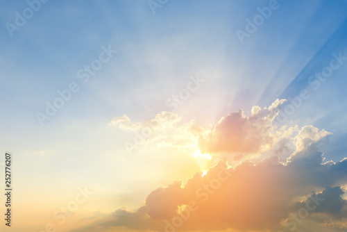 Beautiful dramatic sky clouds with light rays at sunset. Natural landscape for background