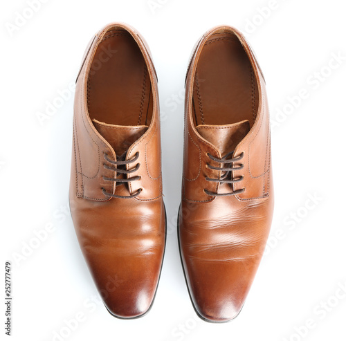 Pair of stylish male shoes on white background
