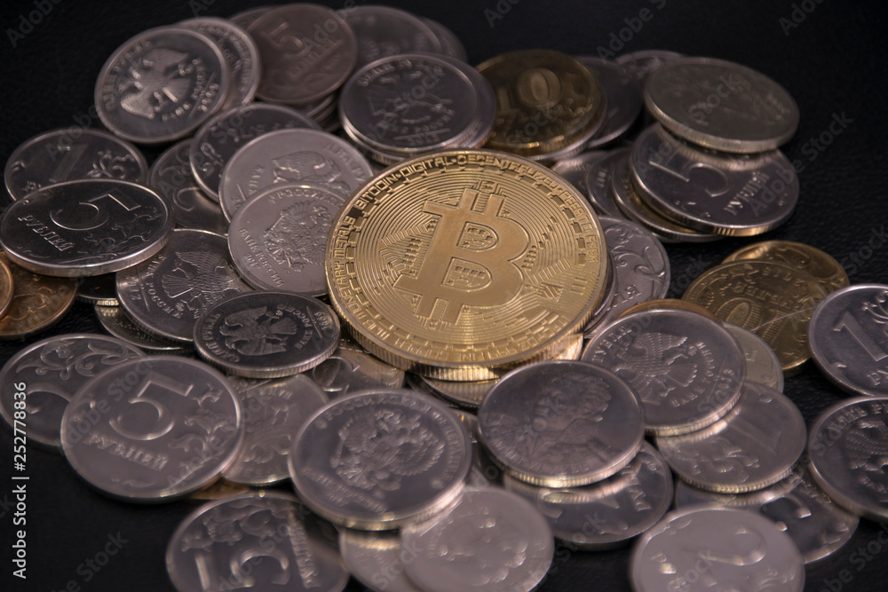 gold bitcoin coin on top on other coins gold bitcoin coin on top on other coins