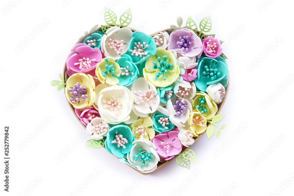 heart of artificial flowers handmade isolate on a white background. Copy space...