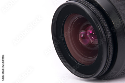 photo lens close - up with a reddish tint on a white background.