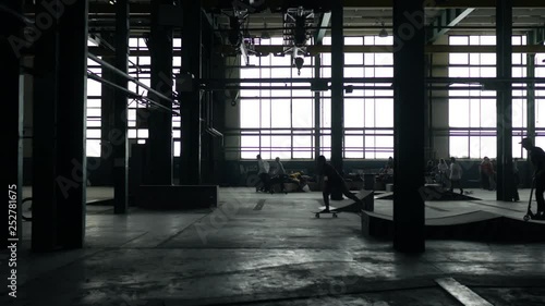 skate park in a dark old hangar building photo