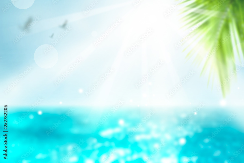 Vivid Summer background.  Blurred Palm and tropical beach bokeh background. Vacation time.