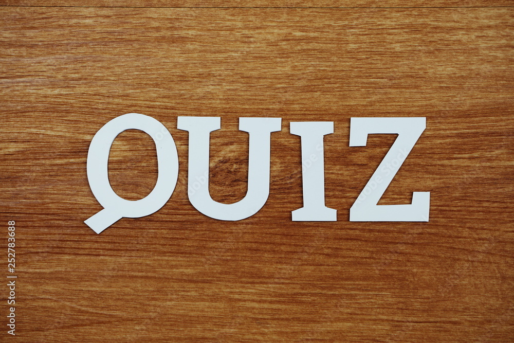 Top view Quiz letters alphabet letters on wooden background Top view Quiz letters alphabet letters on wooden background