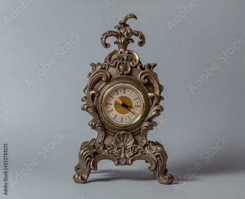 Old vintage clock isolated on light background