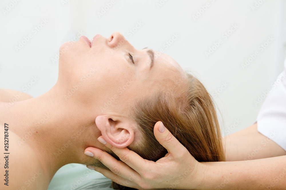 Woman on spa massage treatment in beauty spa salon. Cosmetologist making girl relaxing Face and head massage. Beautician doctor and patient. Spa skin and body care. Beauty treatment. Cosmetology. Woman on spa massage treatment in beauty spa salon. Cosmetologist making girl relaxing Face and head massage. Beautician doctor and patient. Spa skin and body care. Beauty treatment. Cosmetology.