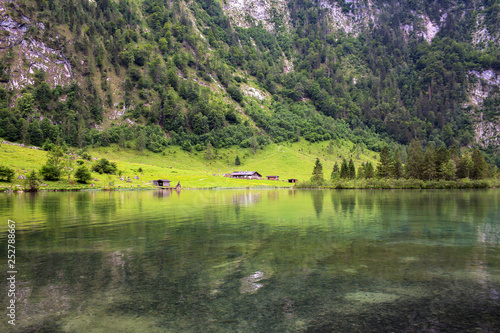 House on the shore of a large Konigssee Lake with in Alps photo