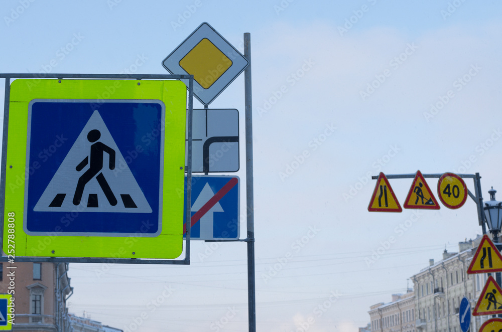 Road signs of the crosswalk, the direction of movement and the prevention of repair work in the city Road signs of the crosswalk, the direction of movement and the prevention of repair work in the city