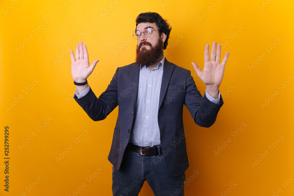 Do not look at me, it was not my fault. Portrait of unaware worried bearded guy in formal raising palms in surrender gesture Do not look at me, it was not my fault. Portrait of unaware worried bearded guy in formal raising palms in surrender gesture