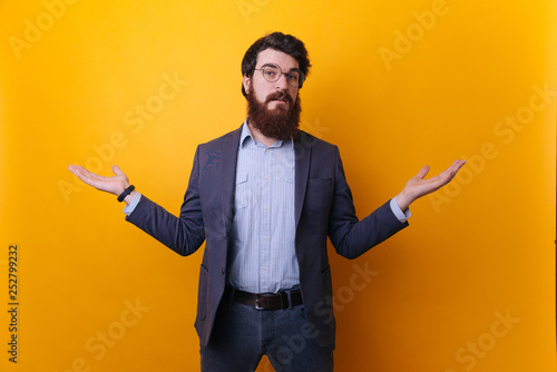 I don't know. Bearded man in formal doing don't know gesture. Human body language. Whatever attitude reaction