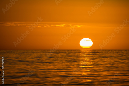 Beautiful sunset over the sea with clear sky in Anna Maria Island, Florida © CheriAlguire