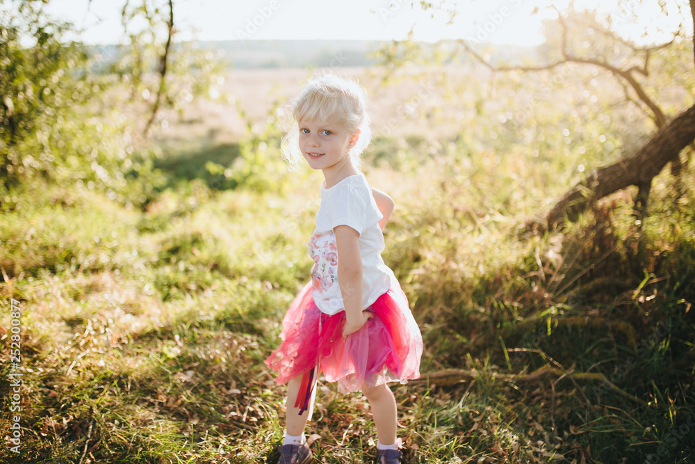 Cute young girl play in garden Cute young girl play in garden