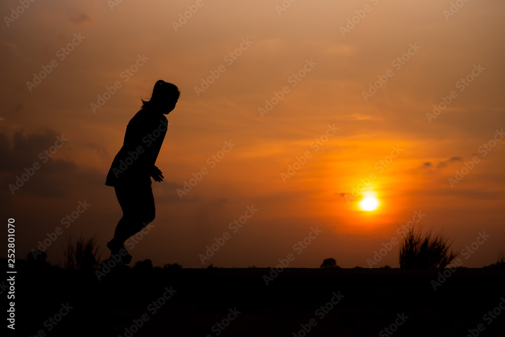 young fitness woman running on sunset seaside trail - Image