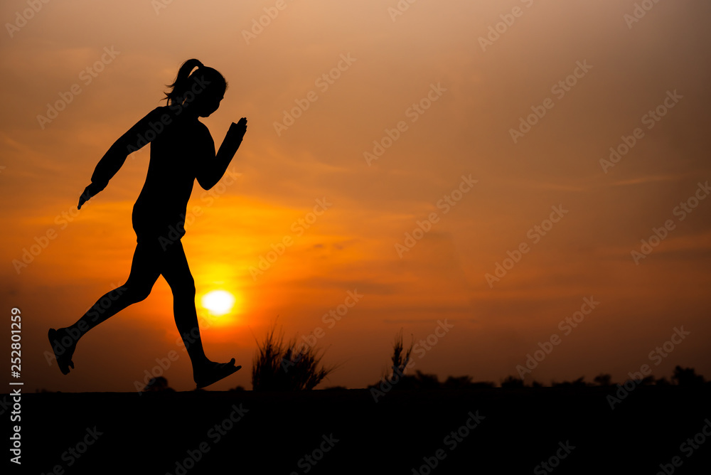 young fitness woman running on sunset seaside trail - Image