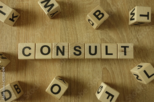 Consult word from wooden blocks on desk