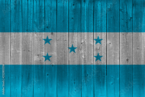 Honduras flag painted on old wood plank photo