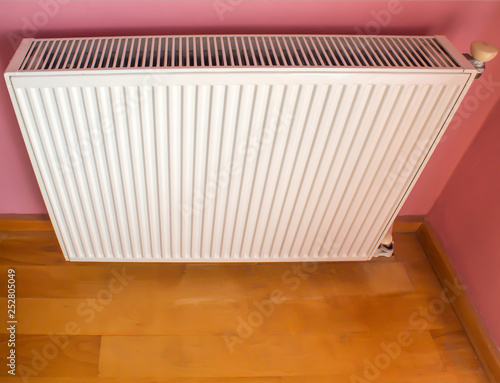 Wallpaper Mural Modern radiator on color wall indoors. Central heating system Torontodigital.ca