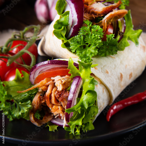 Tasty wraps filled with pulled pork and salad